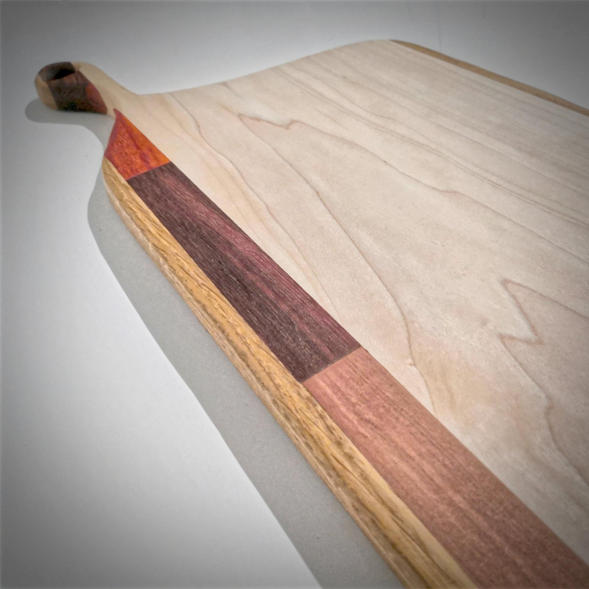Different hardwoods combined in a serving board