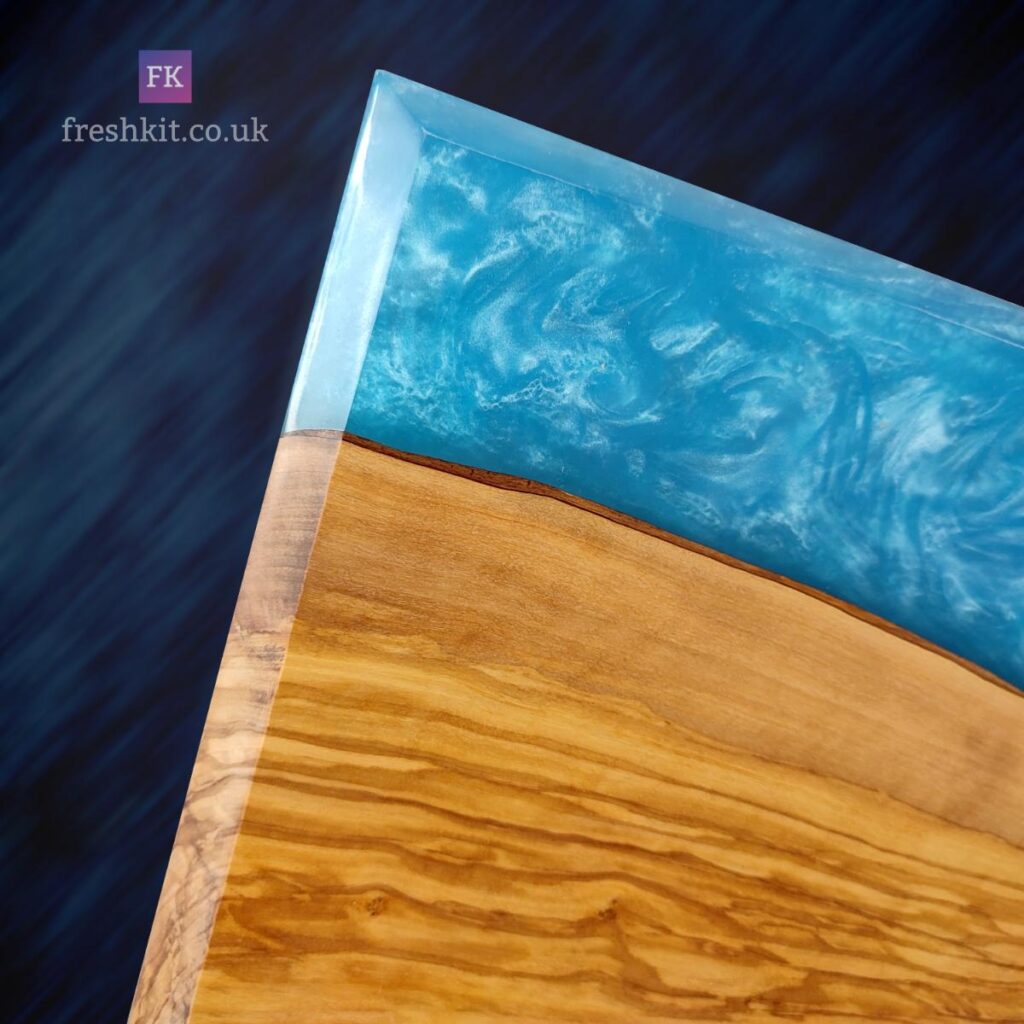 Crystal Cove Epoxy Art 1 - angled top left corner highlighting detail within the epoxy resin portion of this wood art piece