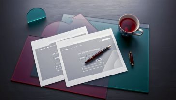 A hyper-realistic photograph from a top-down perspective of a clean, modern desk in a British home office. On the left, a single sheet of paper with a simple, elegant web page design. On the right, two identical sheets of paper, showing the design has been perfectly duplicated. A stylish fountain pen rests nearby, along with a cup of tea in a classic Burleigh mug. The lighting is soft and natural, coming from a nearby window, creating a calm, productive, and sophisticated mood. The colour palette is muted with greys, whites, and a touch of deep blue from the mug.