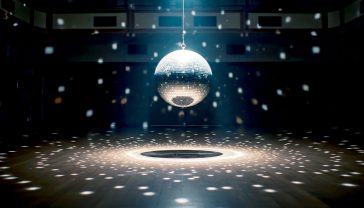 A hyper-realistic, atmospheric photograph capturing a vintage, slightly worn disco ball hanging in the centre of a classic British ballroom, reminiscent of the Wigan Casino. The dance floor below is empty but covered in a light dusting of talcum powder, with faint scuff marks visible. A single, soft spotlight from above hits the disco ball, casting hundreds of gentle, warm light speckles across the dark, wood-panelled room and a sprung wooden dance floor. The mood is nostalgic, reverent, and full of latent energy, as if the dancers have just left and their ghosts remain. The style should be evocative of a high-end documentary film still, with deep shadows and a rich, cinematic texture.