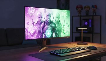 A hyper-realistic, professional photograph of the LG UltraGear 27GR93U gaming monitor on a sleek, dark wooden desk. The monitor displays a vibrant, action-packed scene from a popular fantasy RPG, with glowing magic effects lighting up the screen. To the side of the monitor, a modern gaming keyboard and mouse are subtly illuminated by a soft, warm desk lamp. In the background, the room is dimly lit, with a few collectible gaming figures visible on a shelf, creating a cosy and authentic British gaming den atmosphere.